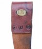 Brass plate with ship number on the backside of a M1895 Navy scabbard (belt loop).jpg
